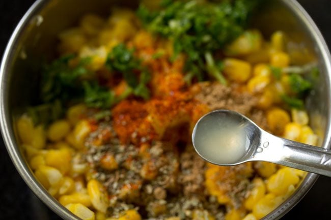 adding lemon juice to the bowl. 