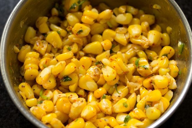 ingredients mixed well to make masala corn. 