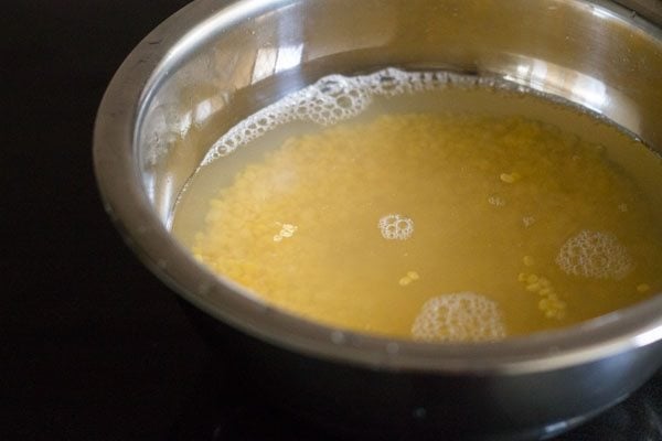 soaking moong dal in water. 
