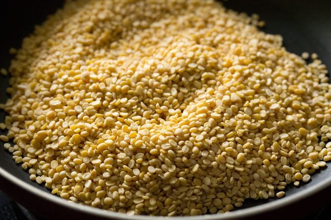 moong dal added to a pan. 