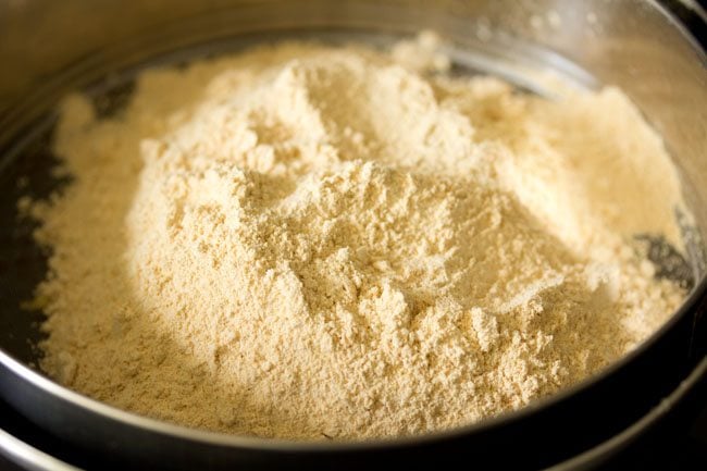 moong dal flour added to a fine sieve. 