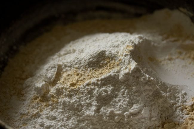 powdered sugar added to the sifted moong dal flour. 