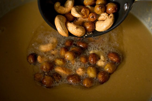 Add fried cashew nuts and raisins to the Payasam along with coconut oil. 