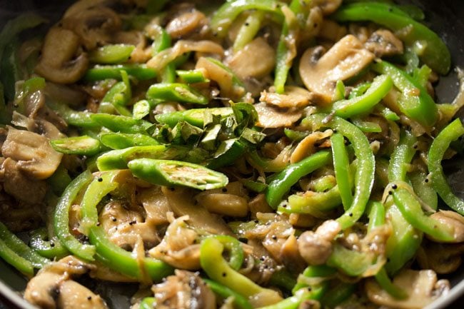 sliced green chili and chopped curry leaves added to the pan. 