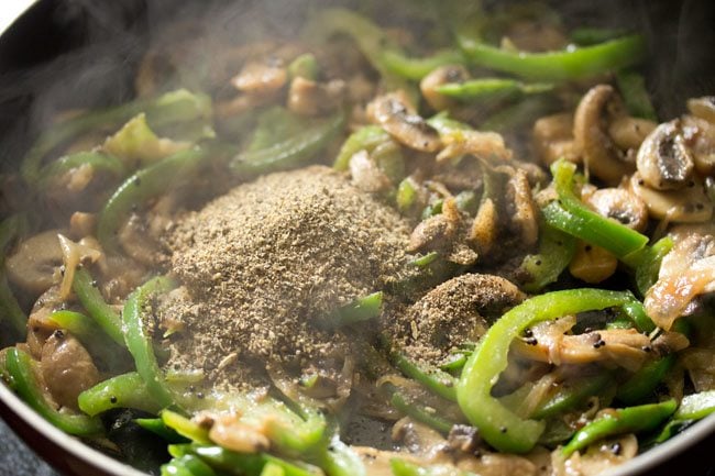 prepared spice powder added to the pan. 