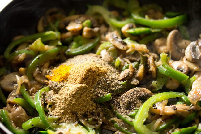 coriander powder, cumin powder and turmeric powder added to the pan. 