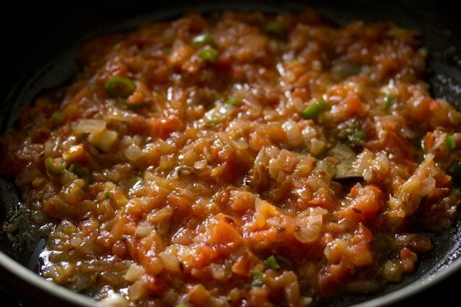 sautéing tomatoes till mushy. 