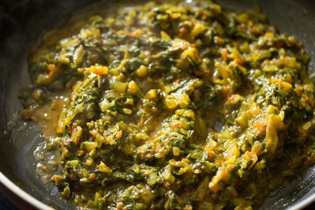 water released by spinach mixture in the pan. 