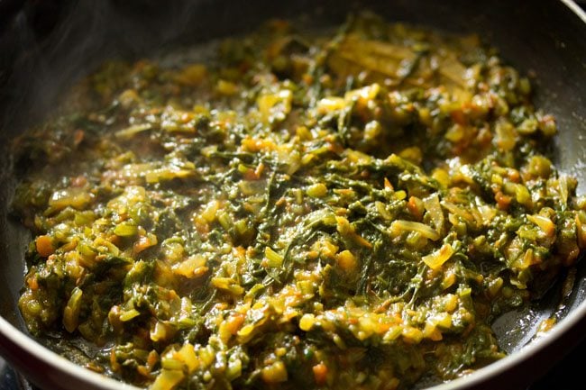 cooking spinach mixture till all the water evaporates. 