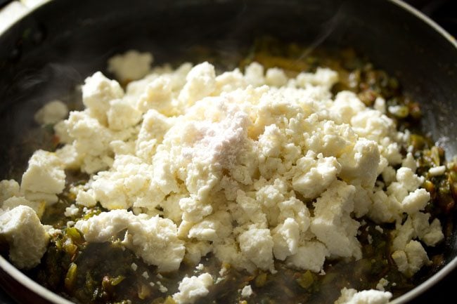 crumbled paneer and salt added to spinach mixture. 