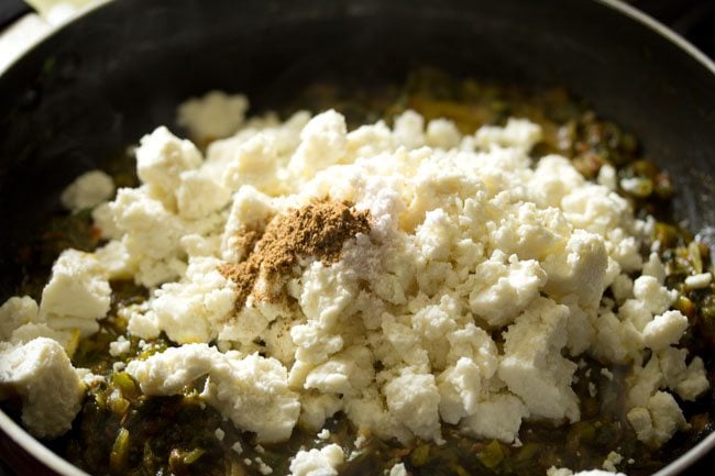 garam masala powder added to palak paneer bhurji mixture. 