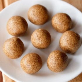peanut ladoo served on a white plate.