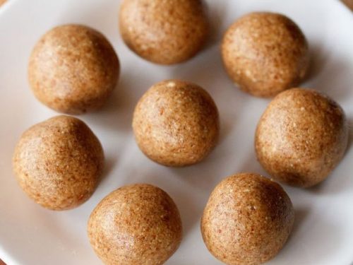 peanut ladoo served on a white plate.