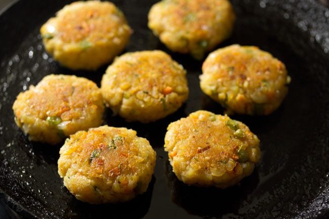 pan frying poha cutlet till evenly done on both sides. 