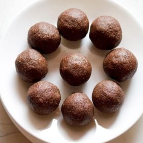 ragi ladoo served on a white plate.