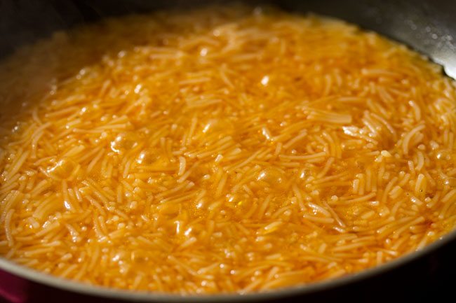 cooking semiya kesari in pan. 