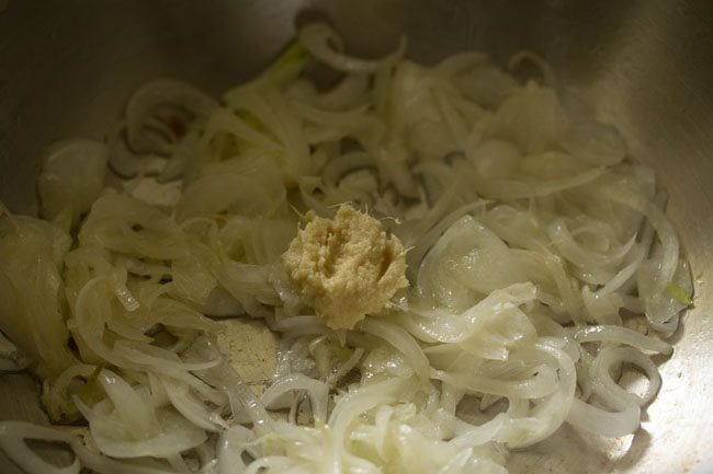 ginger-garlic paste added to the onions in the kadai. 