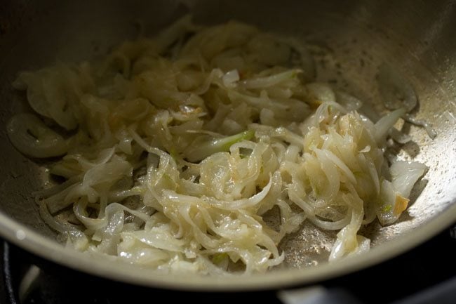 sautéing the onions mixture in the kadai. 