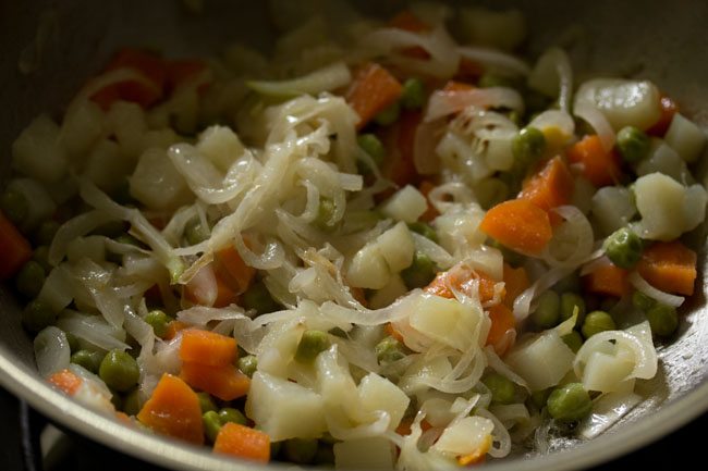 steamed vegetables mixed well in the kadai. 