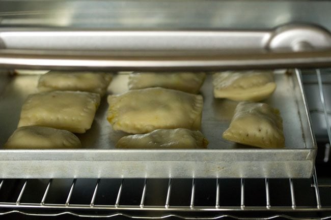 veg puffs placed in the oven for baking. 