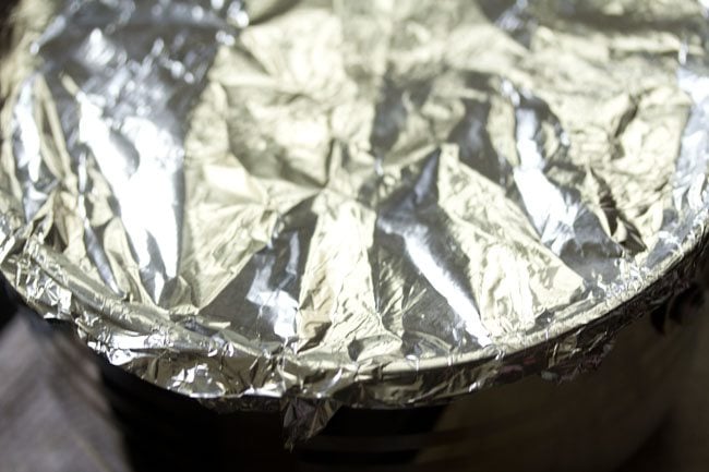 sealing the pan with aluminium foil