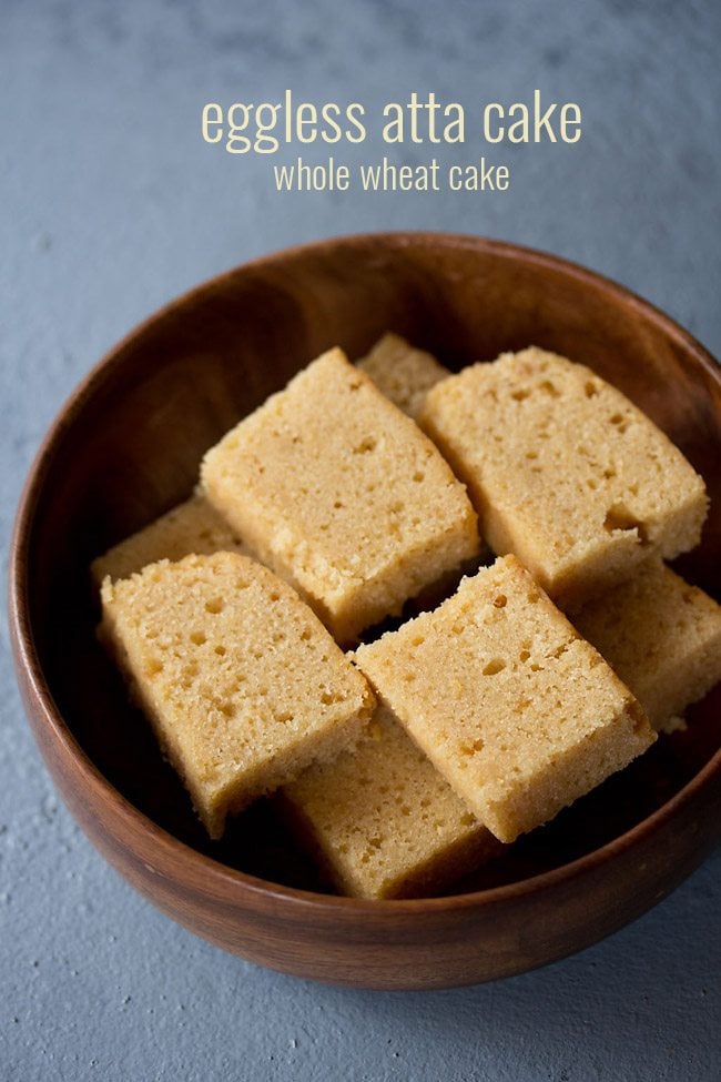 slices of wheat cake kept neatly in a wooden bowl on a light grayish blue board