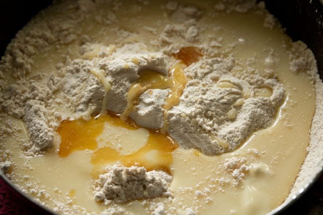 condensed milk, vanilla extract on top of wheat flour for making wheat cake