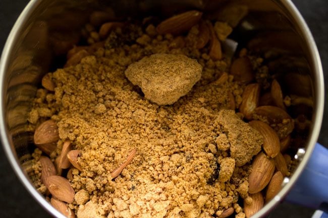 Add jaggery powder to the grinding jar. 