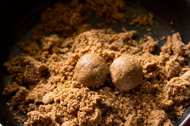 shaping ladoos from the prepared mixture. 