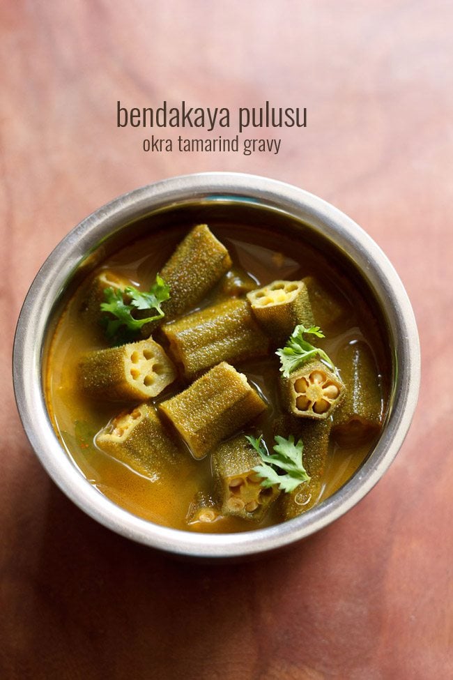 bendakaya pulusu garnished with coriander leaves and served in a steel bowl with text layovers.