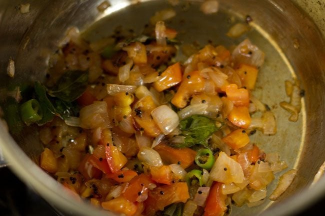 Sauté until the tomatoes are soft. 