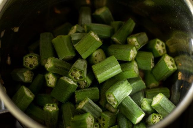 Add the okra slices to the pot. 