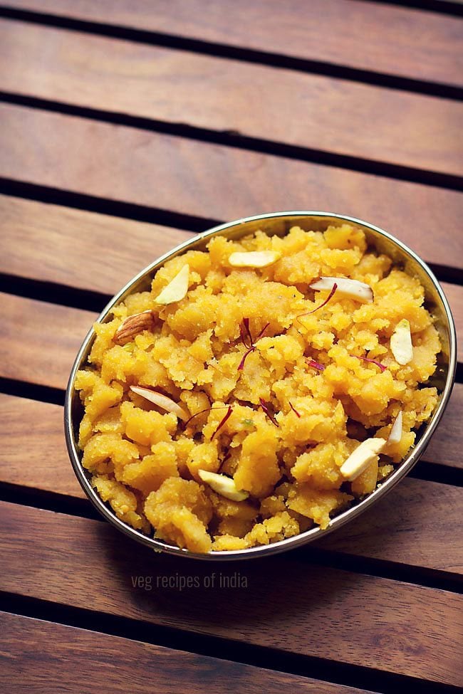 besan halwa served in a plate garnished with nuts