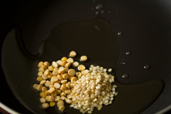 lentils in oil in a black pan