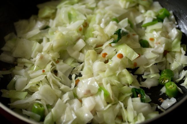 cabbage being sautéed