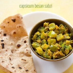 capsicum besan bhaji served in a bowl with chapatti placed on a plate and text layover.