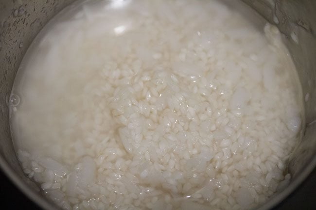 strained rice and fresh water added to grinder jar. 