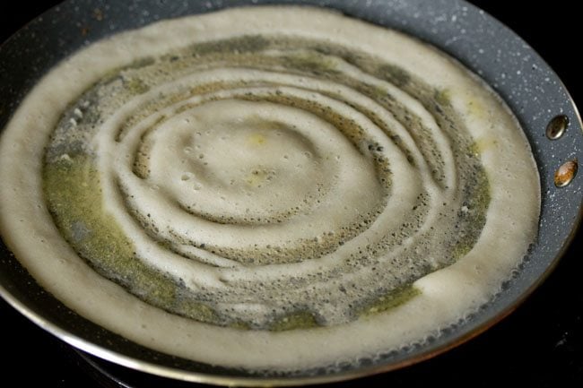 ghee drizzled on the sides and top of the dosa. 