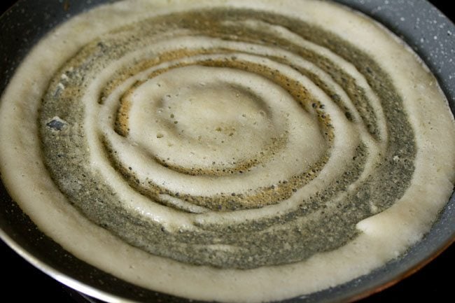 cooking ghee roast dosa. 