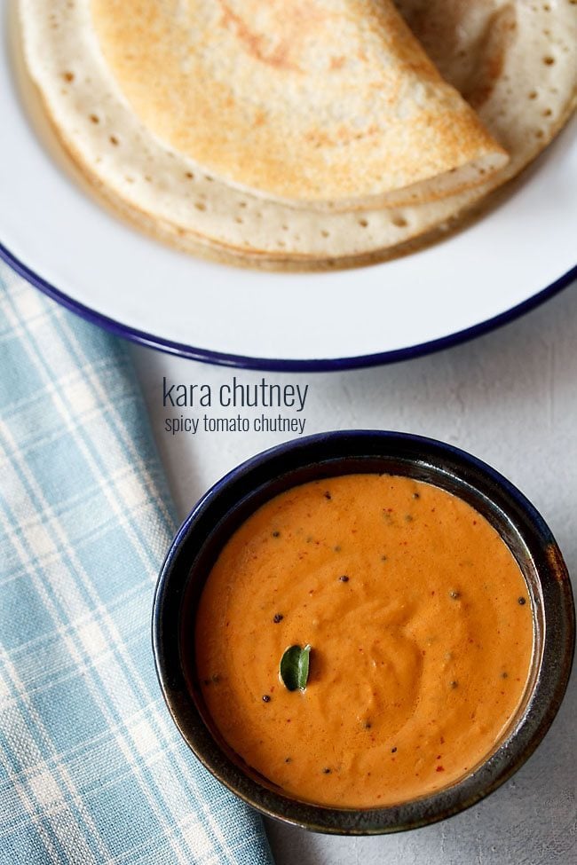 kara chutney served in a black bowl with a plate of dosas kept in the top side and text layovers.