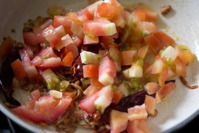 chopped tomatoes added to the pan. 