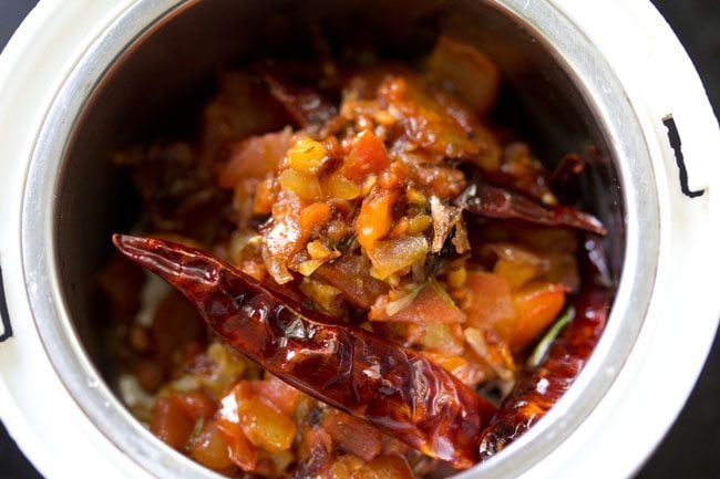 cooked chutney mixture added to a grinder jar along with some water.