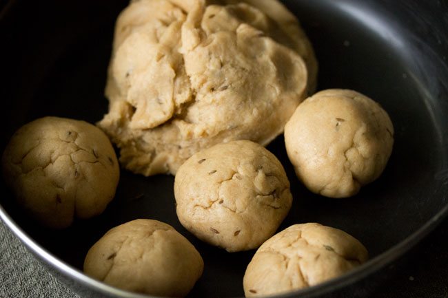 dough divided into medium sized balls. 