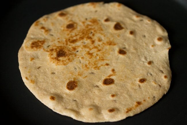 roasting khasta roti. 