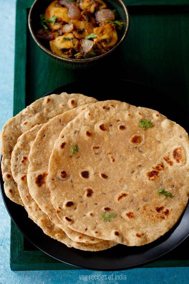 The khasta roti was served on a black plate with a bowl of vegetables and a stopover text written on it.