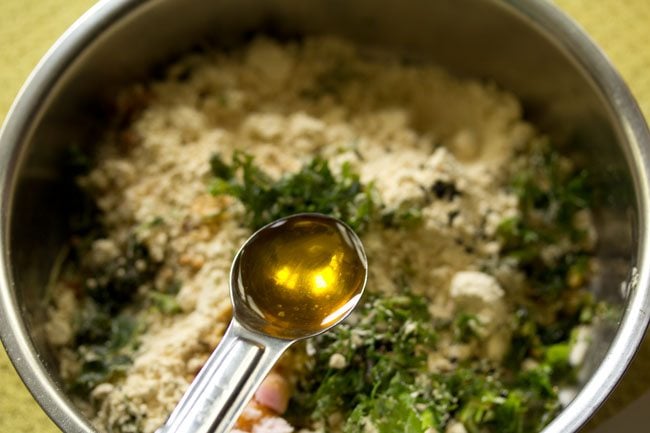 adding mustard oil to the bowl. 