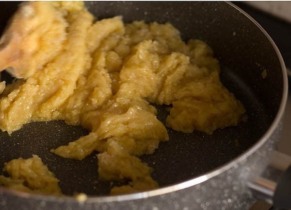 stirring the mawa-sugar mixture. 