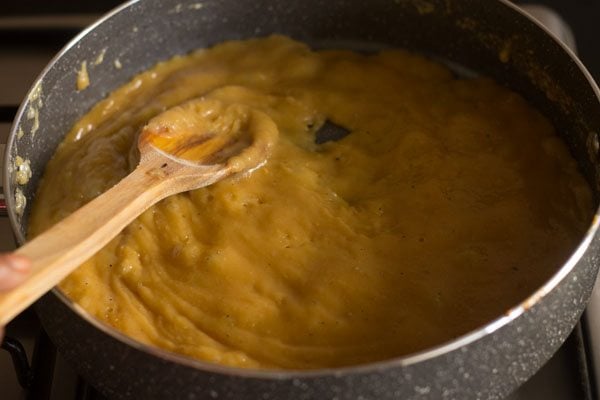 stirring the mawa mixture. 