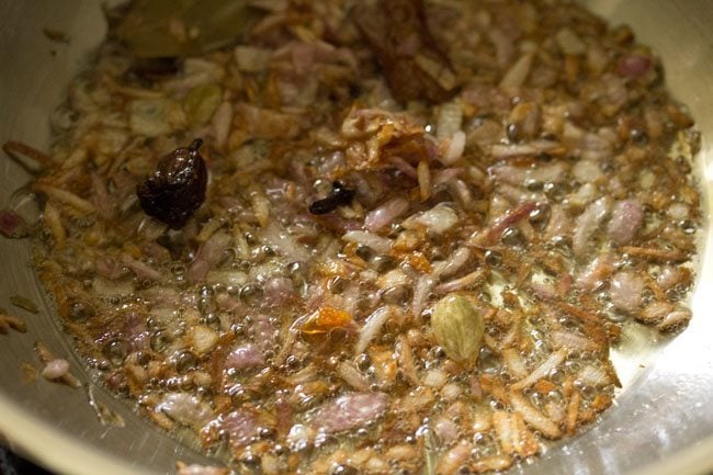 sauteed golden onions in the pan