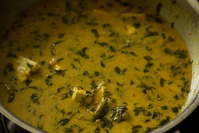 mixing the cream with the methi paneer curry